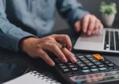 Man using calculator